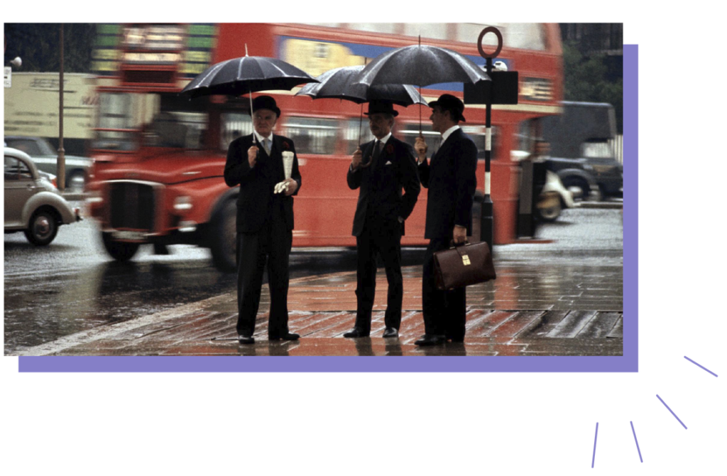 Tres hombres bajo la lluvia.